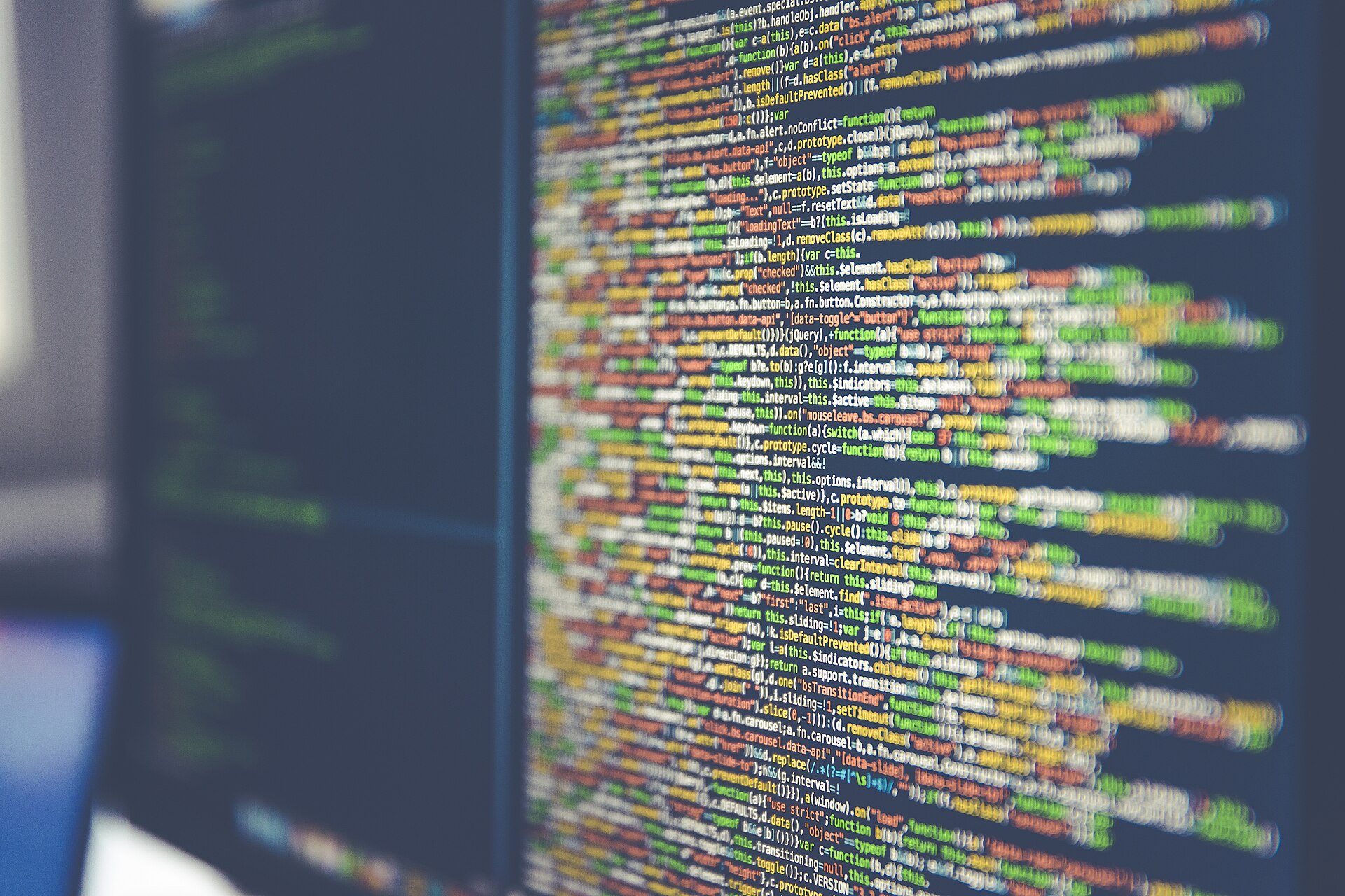 Close-up of colorized source code on a computer monitor