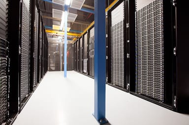 Rows of server racks in a data center